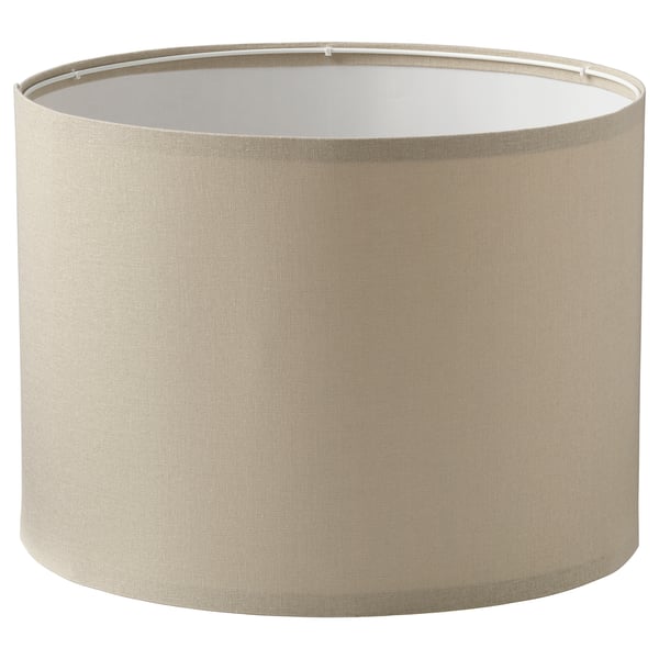 A beige fabric lampshade named RINGSTA. Its cylindrical with minimal design.