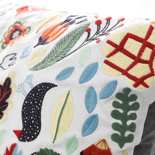 Embroidered cushion, vibrant colours & patterns. High-quality stitching, intricate leaf & floral designs.