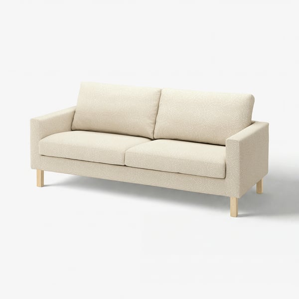 Modern beige sofa with floral pattern, wooden legs, soft cushions. Ideal for living rooms.