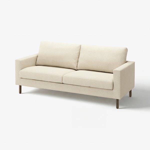 A beige SALTSJÖBADEN sofa with a floral pattern and wooden legs, designed for comfort and easy cleaning.