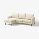 A beige, l-shaped SALTSJÖBADEN sofa with a simple, clean design and wooden legs. It back cushions and a removable cover.