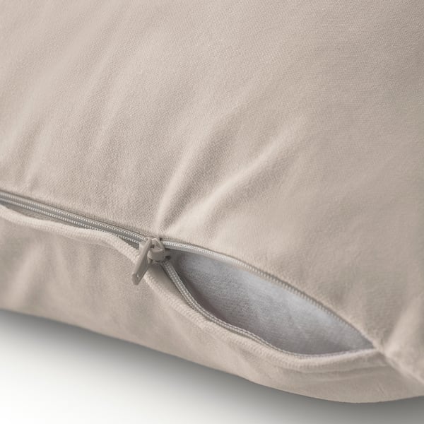 Hidden zip on soft beige velvet cushion cover, easy to remove for washing.