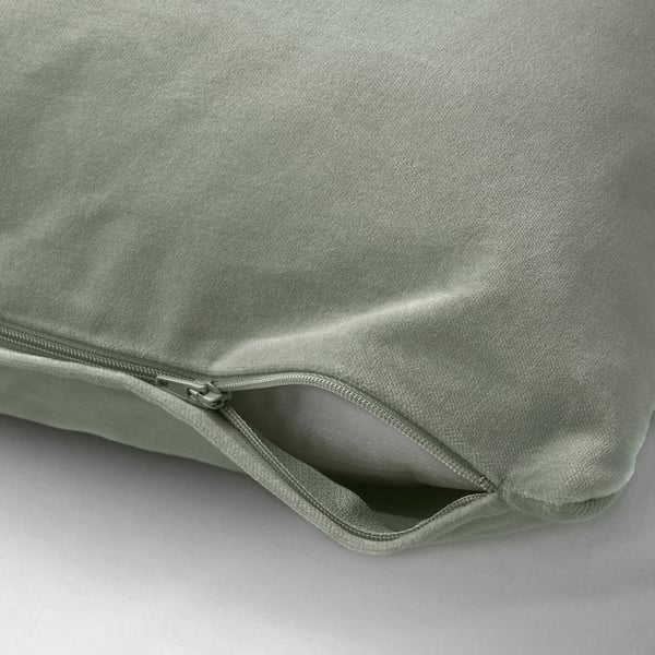 Light green cushion cover with zip. Made of soft cotton velvet. Zips open for easy washing.