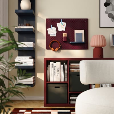 SKÅDIS pegboard in dark lilac-red on wall with accessories.