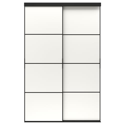 A SKYTTA sliding door in black with frosted glass panels. The modern design an anodized aluminium frame and pine support rails.