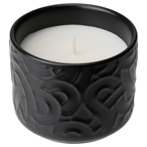 Black ceramic candle with textured design. Holds unscented white candle. Ideal for home decor.