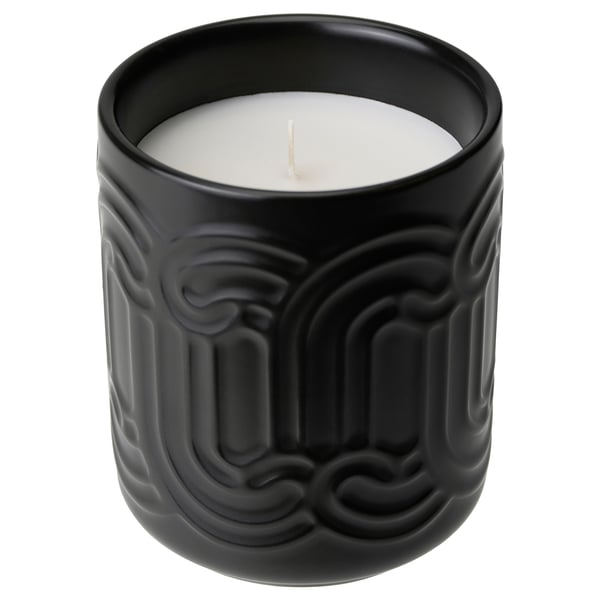 Black SÖTRÖNN candle in textured ceramic jar with green matcha tea and ginger scent.