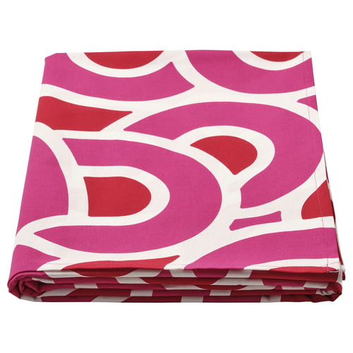 Folded colourful cotton tablecloth, magenta & red swirls, geometric patterns, square shape.