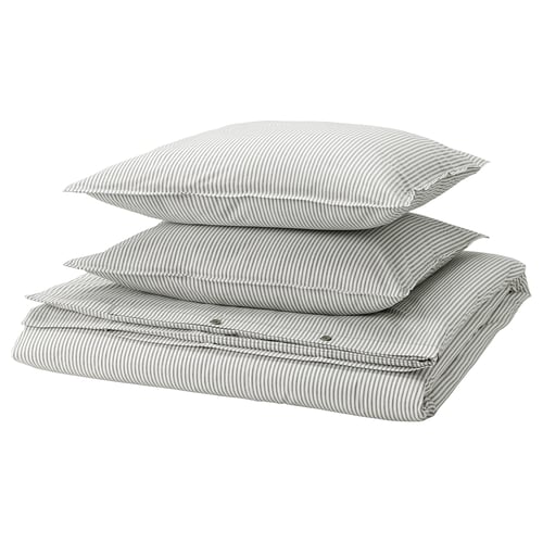 Stack of grey striped pillows & duvet cover, folded in grey and white stripes, SOLFIBBLA set by IKEA.