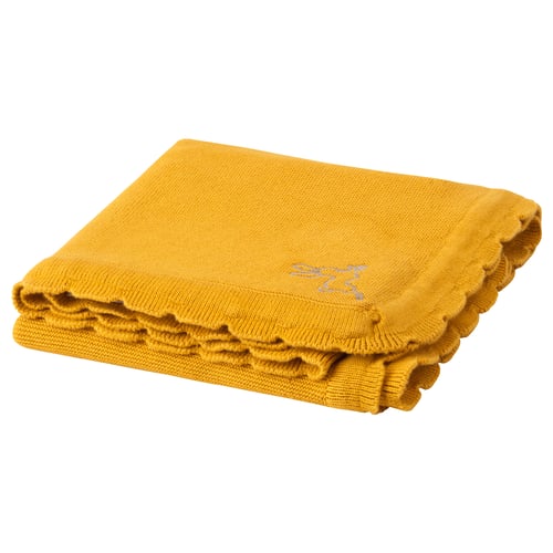 Bright yellow SOLGUL baby blanket, folded, with scalloped edges and small white text design, made from soft cotton.
