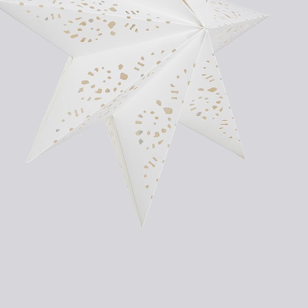 White star-shaped lamp with intricate, glittering patterns. Ideal for festive decoration.