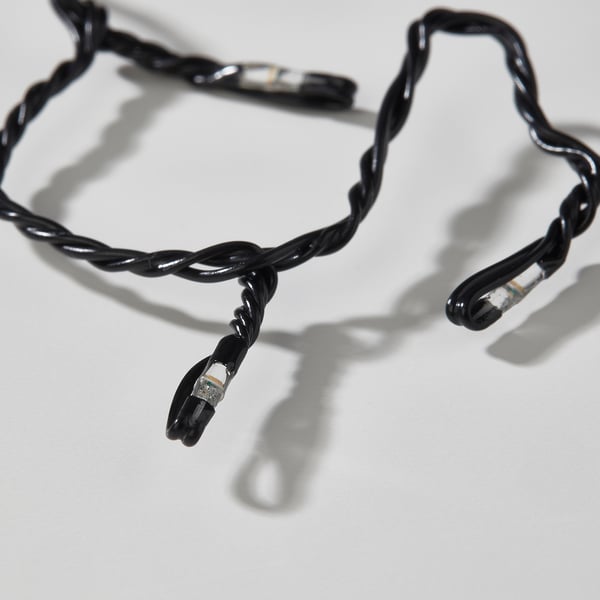 Black twisted led lights with hooks, laid out on white surface.