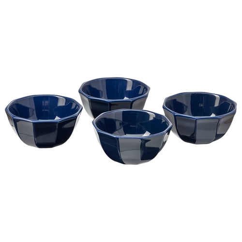 Four dark blue, faceted ceramic bowls arranged in a square formation. Highlighting geometric design and glossy finish.