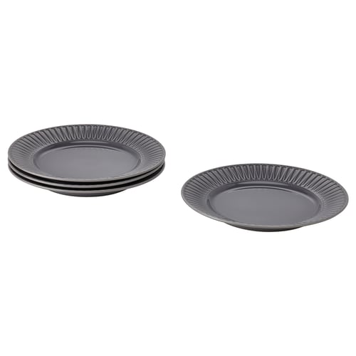 Black ceramic plates, fluted rim, sleek, modern appearance.