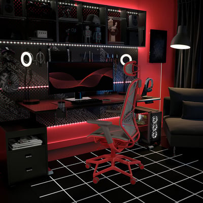Modern gaming room with red STYRSPEL chair, led lights, dual monitors, and black decor.