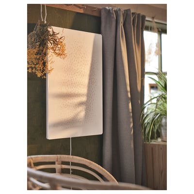 White SYMFONISK speaker, blend of picture frame and wifi speaker, sleek rectangular design.