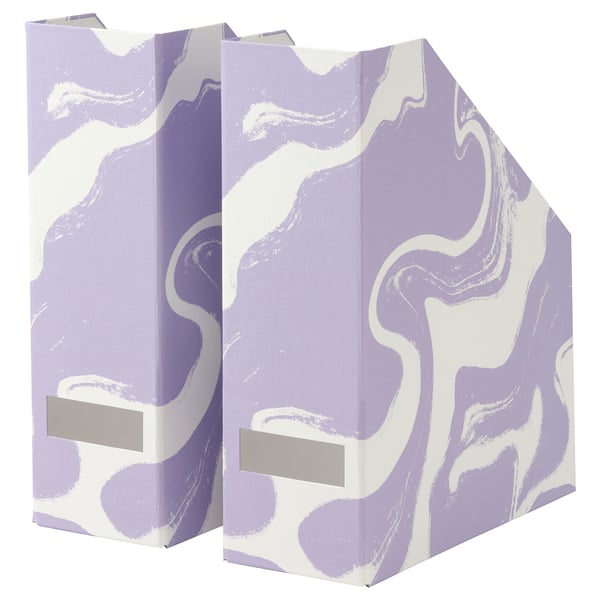Two standing TJENA magazine holders, purple with white swirls, made of recycled paperboard, rectangular with cut-out for easy access.