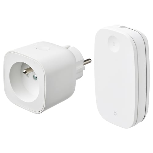 Displays two white smart home devices: a plug adapter and a remote control, both sleek and minimalist.