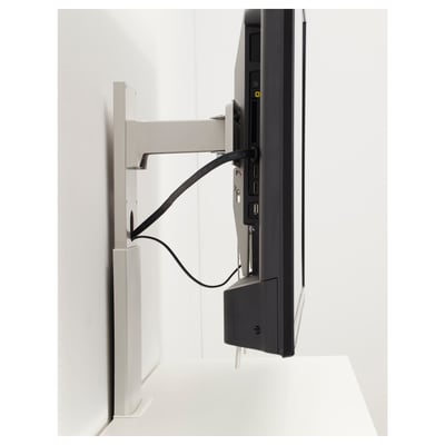 A tv bracket with integrated cable management, securely holding a flat screen tv in an adjustable position against a white wall.