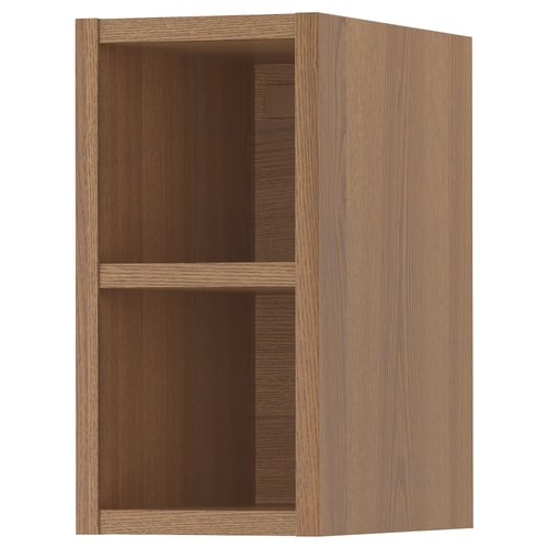 An open wooden VADHOLMA cabinet. Its light brown, rectangular, with open shelves. Ash veneer construction gives it a natural wooden look.