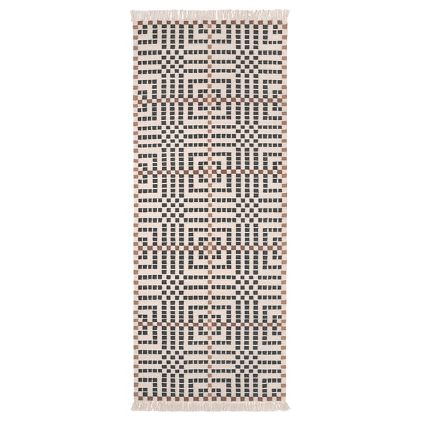 The VAMDRUP rug, handcrafted in white, black, and brown tones, a traditional scandinavian weave pattern, ideal for hallways or bedrooms.