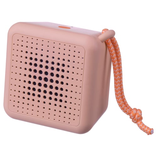 A pink VAPPEBY portable speaker with a braided orange handle. Its rectangular, waterproof, and equipped with holes for sound dispersion.