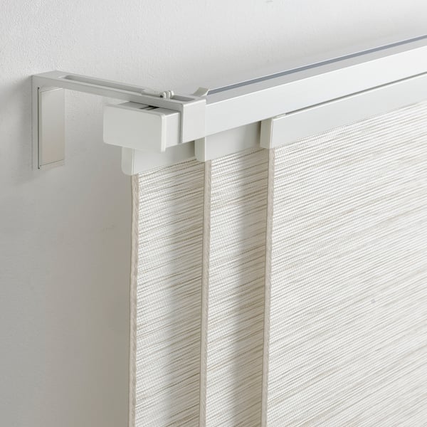 VIDGA curtain rail on ceiling with vertical blinds.
