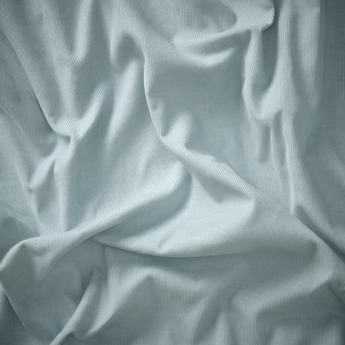 Soft, light blue fabric, delicately crumpled, showing smooth texture and quality of saxemara cotton-polyester blend.