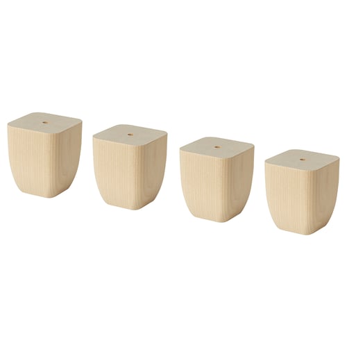 Four light-colored wooden blocks of varying sizes, tapered at the bottom for stability.