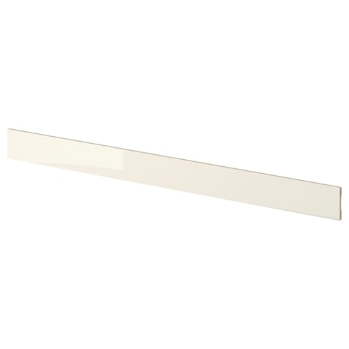 A beige VOXTORP kitchen plinth with a sleek, glossy surface and minimalist design.