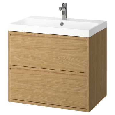 Modern wooden bathroom vanity in oak, featuring two spacious drawers, a white marble sink, and sleek minimalist handles.