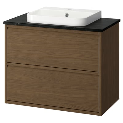 The ÄNGSJÖN bathroom cabinet in brown oak a modern, minimalist design with integrated handles and a semi-recessed white wash-basin.