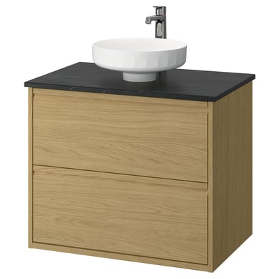 Modern oak bathroom cabinet with black countertop and white bowl sink, sleek design.