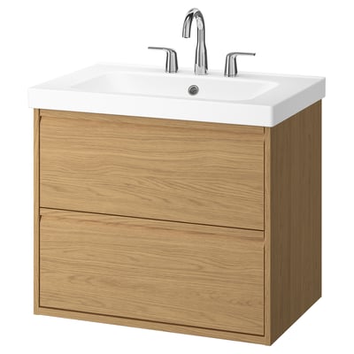 Modern oak wall-mounted bathroom cabinet with white sink and chrome faucets.