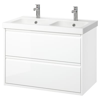 White wall-mounted dual sink vanity with modern design and chrome faucets.