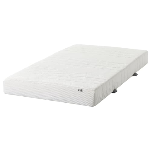 White IKEA ÅSBYGDA foam mattress, rectangular, with memory foam layer for pressure relief.