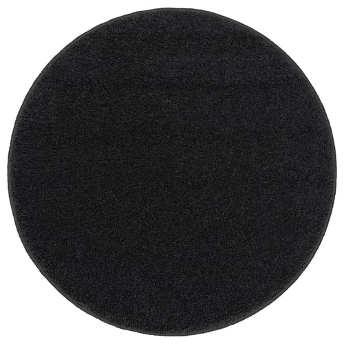 BACKMÅRA bath mat, black, round, soft, recycled polyester, latex backing, fluffy texture.