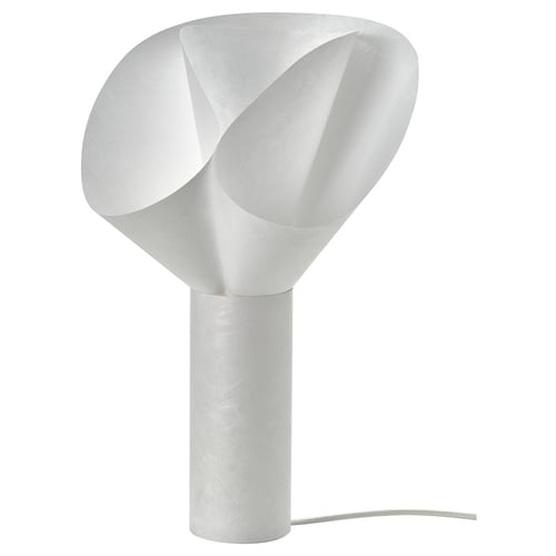The BÄCKNATE lamp is white, with a soft, flower-like shape. Its made from durable, recyclable synthetic paper.
