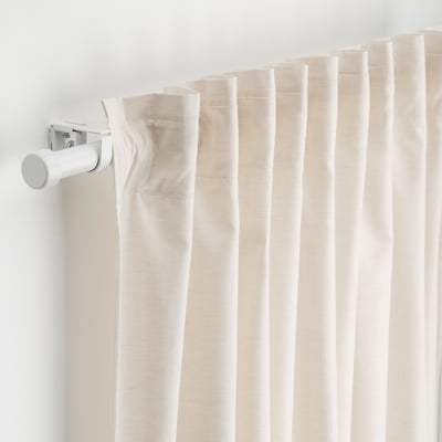 Close-up of BEKRÄFTA curtain rod set, showing rod, finials, and wall brackets, demonstrating easy window dressing mount.