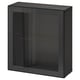 A sleek black BESTÅ storage unit featuring a glass door with a metal frame and tempered glass shelves for modern organising.