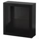 A black BESTÅ storage unit. Its square-shaped with a single glass door. The sleek design includes a glass shelf inside.