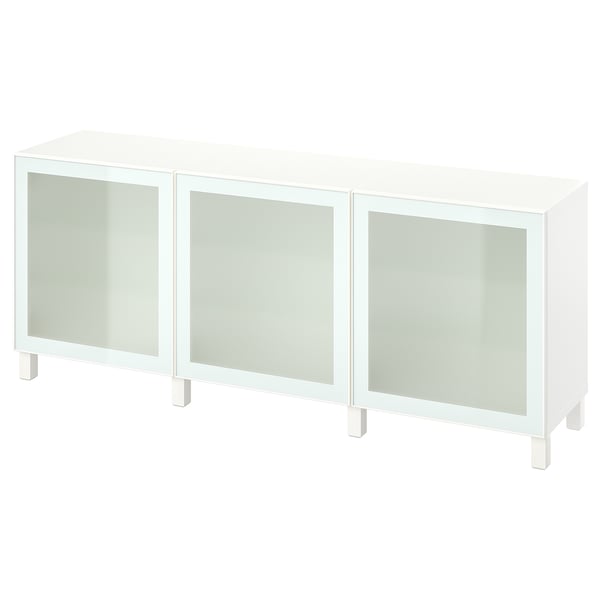 A white BESTÅ sideboard with three glass doors, offering storage and display space. The modern design frosted glass and adjustable shelves.