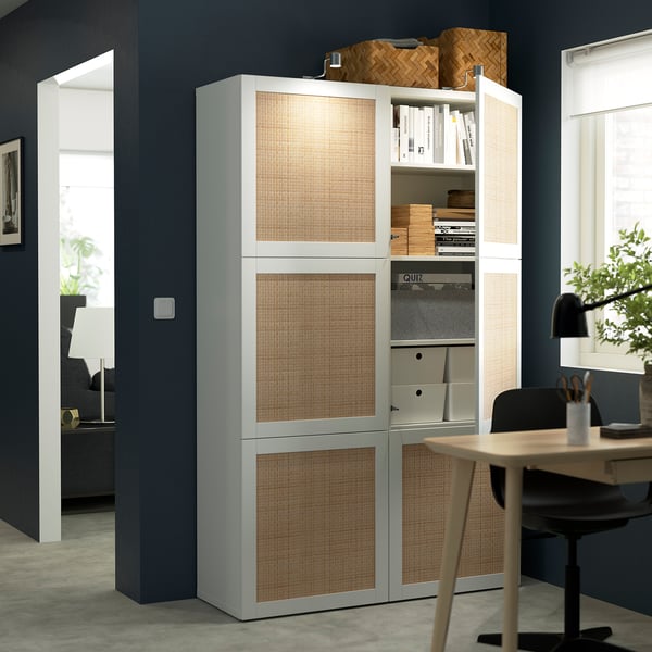 Home office: tall white storage cabinet with books, filing drawers, and containers.