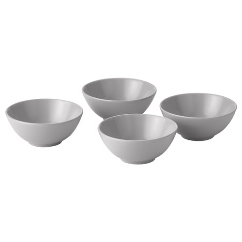 Four grey FÄRGKLAR bowls of varying sizes, simple and functional design, made of stoneware with coloured glaze, arranged neatly.