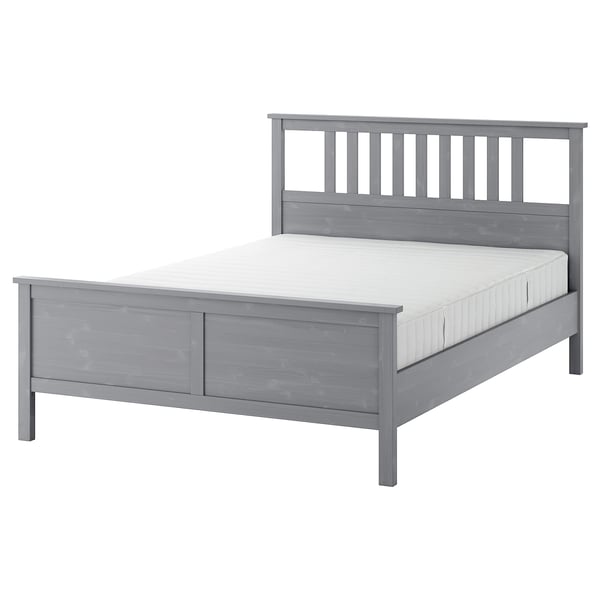 Grey HEMNES bed, wooden, rectangular with panel headboard.