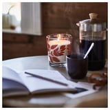 HÖSTAGILLE Scented candle in glass, Vanilla & apple clear glass/orange, 50 hr