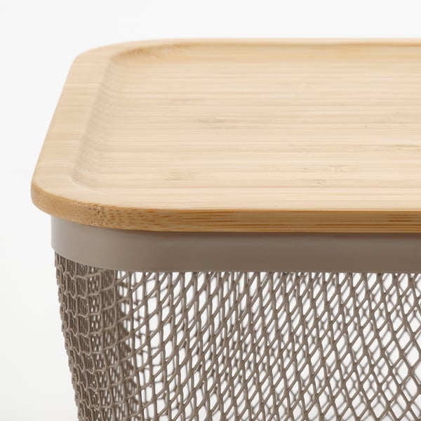 Wooden tray with textured edge on metal mesh stand.