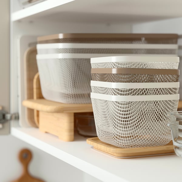 White mesh IKEA 365+ storage baskets with lids on shelf, promoting air circulation for food storage.