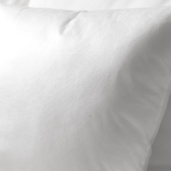 Plush white cushion with soft, inviting fabric, perfect for cosy relaxation.