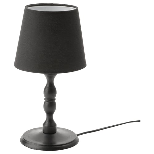 Black KINNAHULT table lamp with conical shade, wooden base, and cord, showcasing scandinavian craftsmanship.